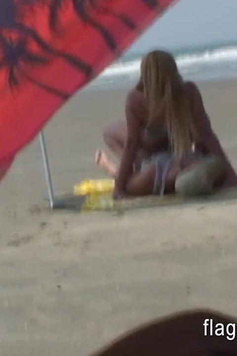 Brazilian couple having sex on the empty beach