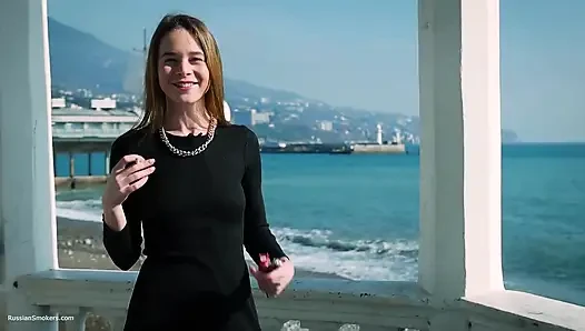 Young Russian Girl Smoking Cigarette by Seaside