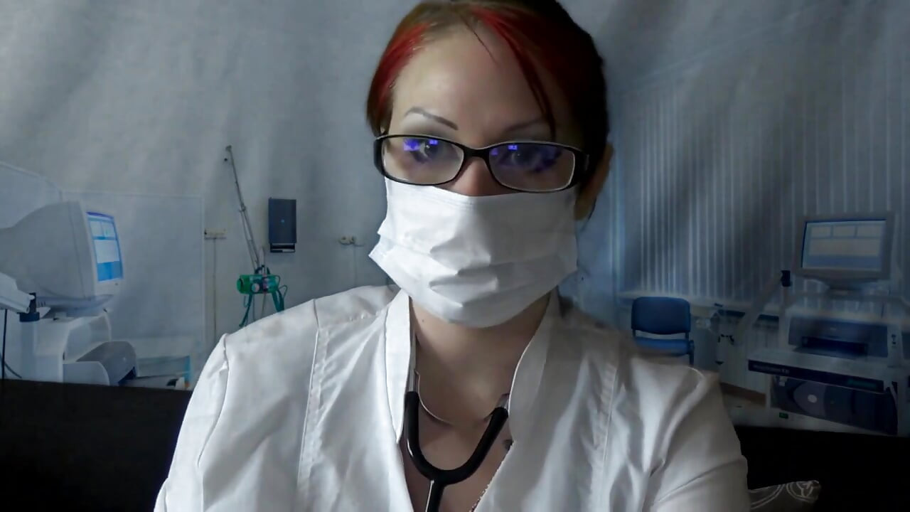Doctor eating in medical mask and gloves
