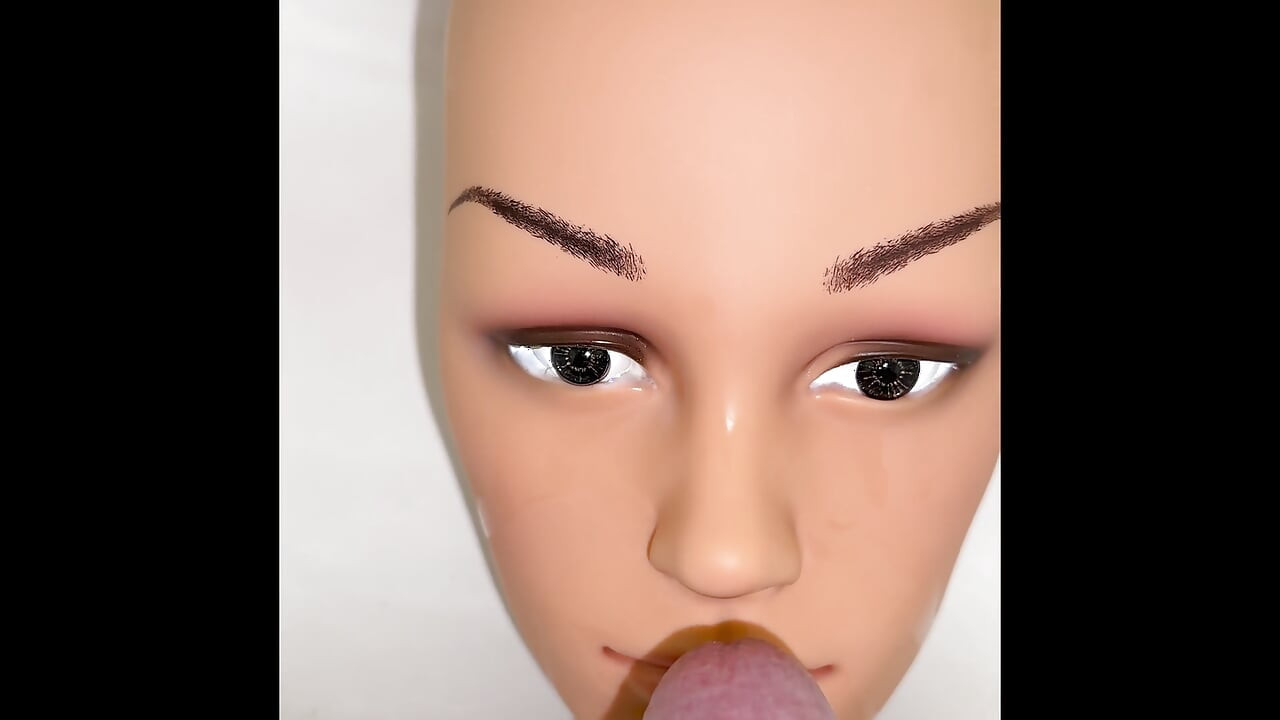 Pissing on a mannequin doll's face