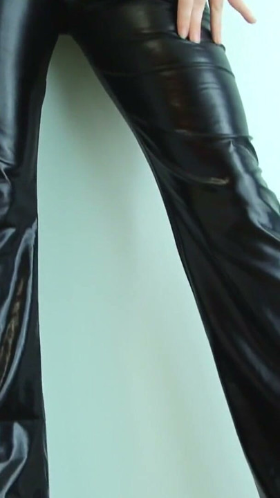 Brunette in sexy shiny trousers bends over to show he shiny ass | Clip 1