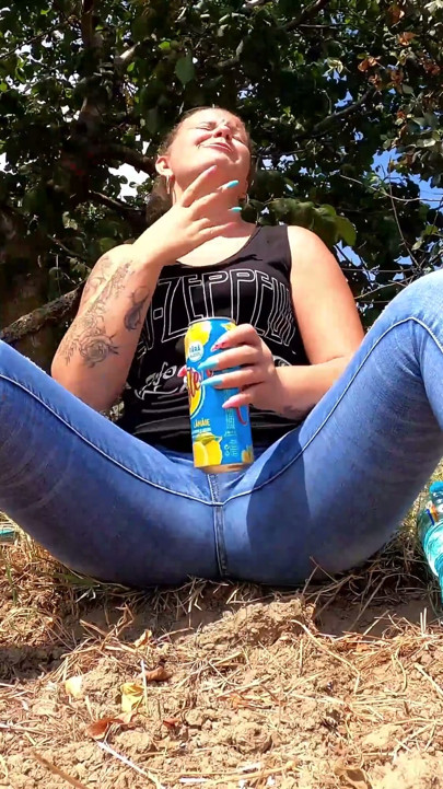 Chubby girl talking on the phone with her boy friend pee in her jeans