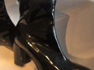 Pissing on black patent ankle boots