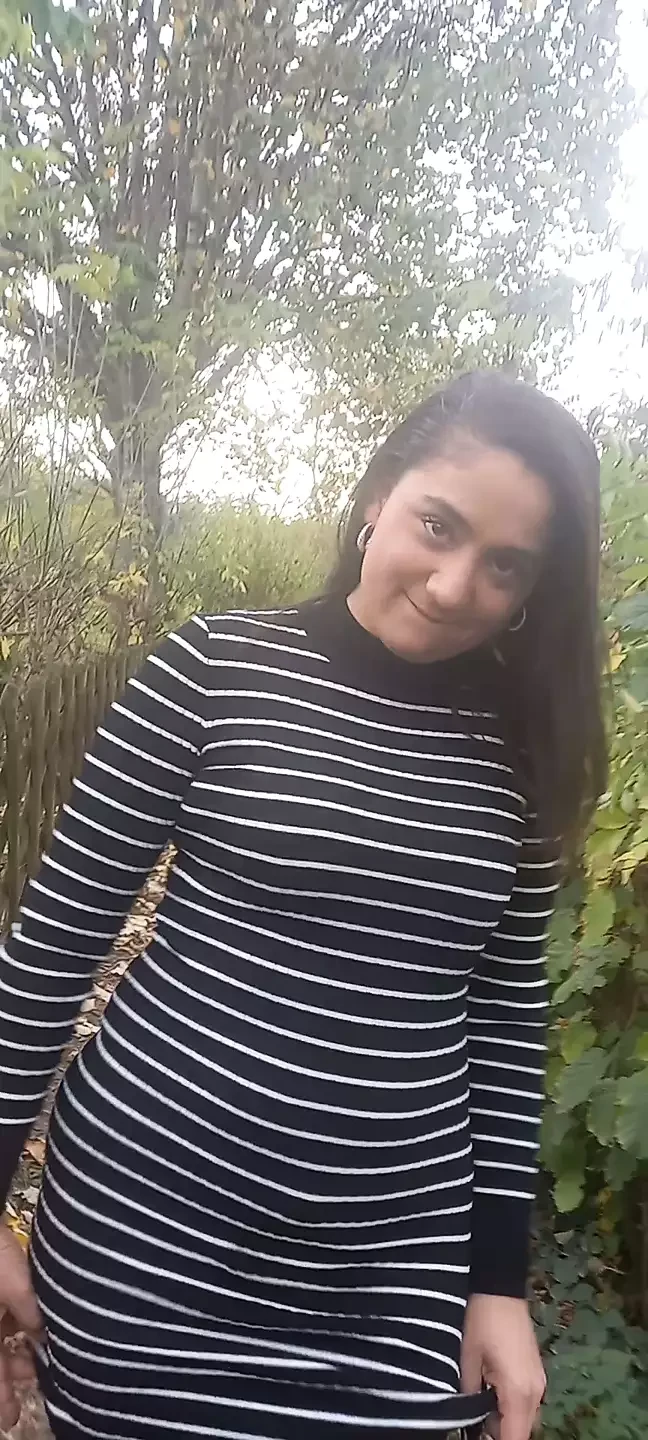 A brunette near the campsite fucks her pussy hard