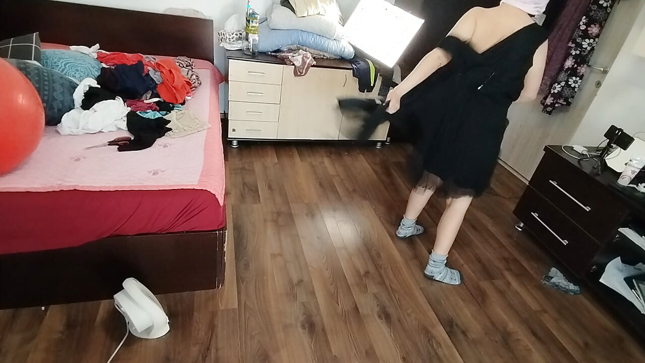 Amateur Woman Has Fun Trying on Clothes and Cutting Them.