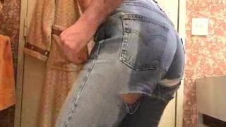 Rub his cock and wetting his jeans