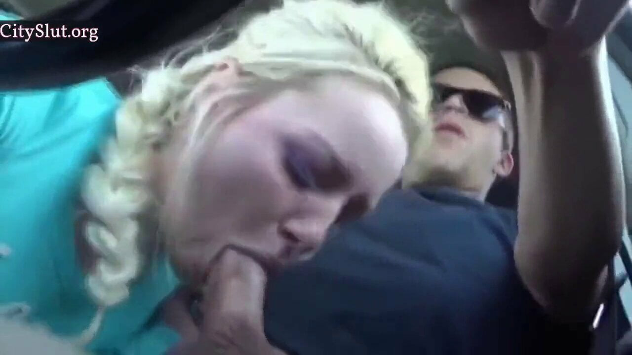 She sucks his cock while he drives the car
