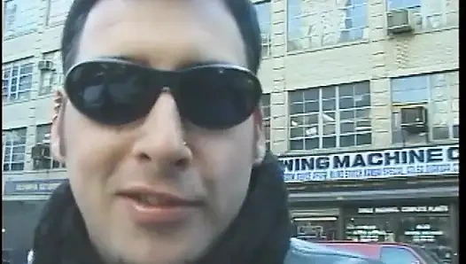 Hot dominatrix in leather with a great body puts a guy in clamps