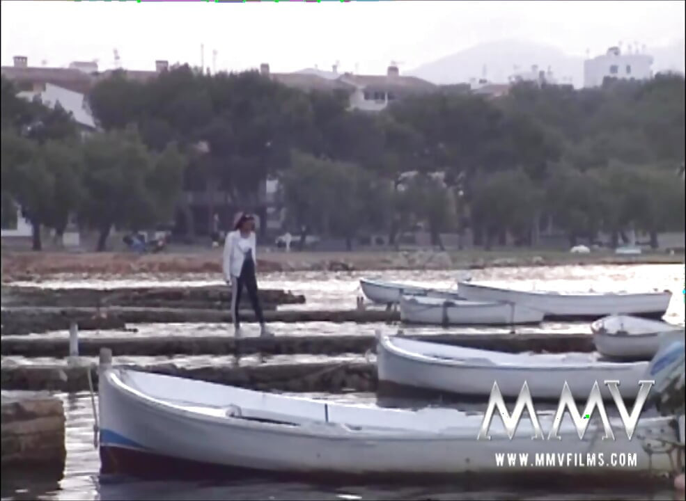 Slim temptress posing nude at the lakem
