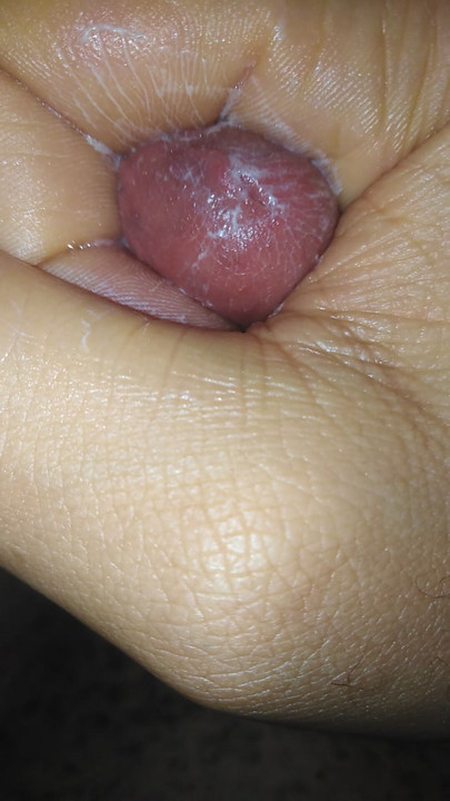 Masturbating