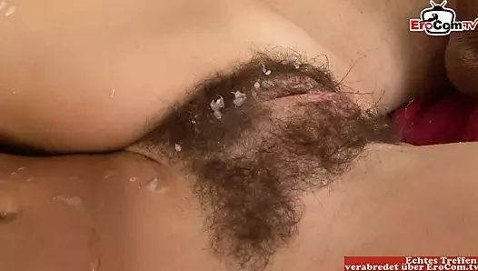 Brunette with small tits gets a cumshot on her hairy pussy