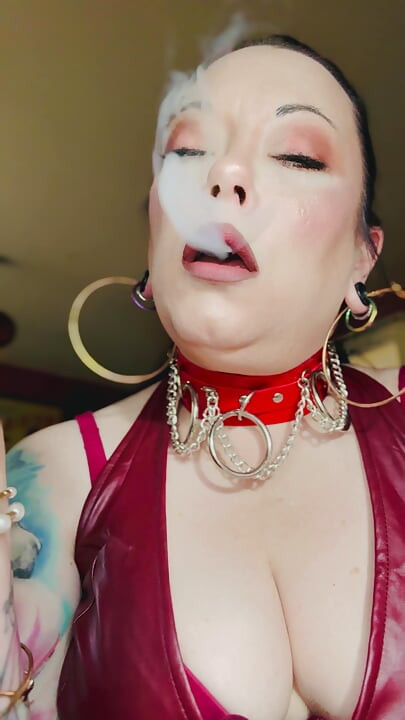 Leather Clad Tina Snua Smoking A Cigarette With Lots Of Dangles