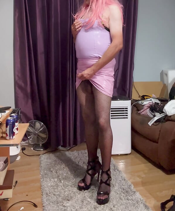 Dressed in pink pvc, fishnets and high heels and edging with lots of cum