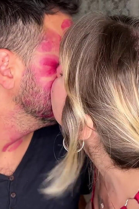 Non Stop Lipstick Kisses All Over His Face
