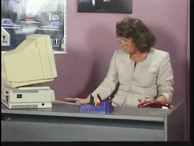 Mature brunette sucks and takes cock by desk at work