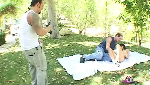 Lucy Thai participates in an explicit outdoor threesome photoshoot that involves engaging in anal sex and double penetration