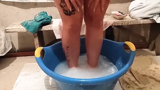 A Village Girl Washes Her Body in a Basin of Water.
