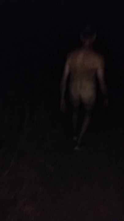 Naked walking on the hill along highway