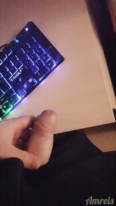 Gamer in the night. Cum on table.