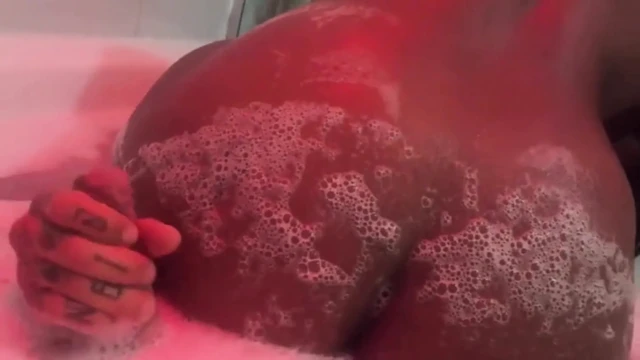 Eating brunette's big ass in the bathtub