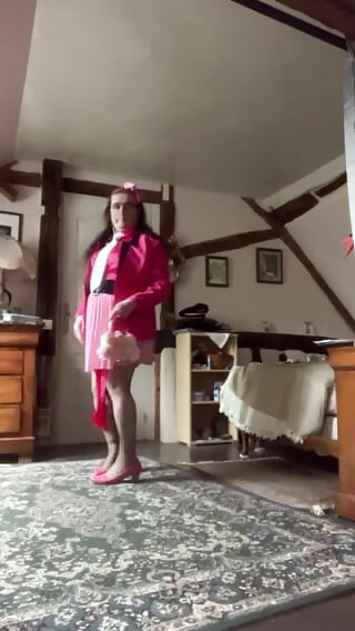 In pink outfit