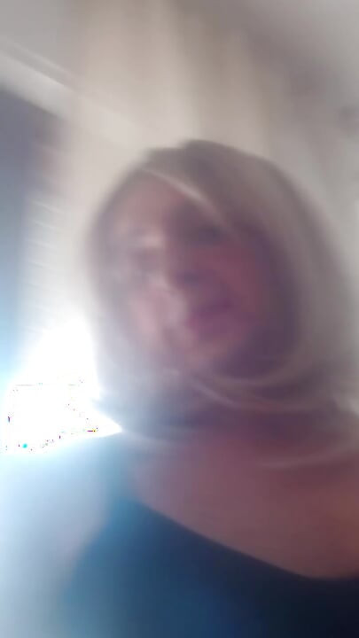 Vany sitting on the sofa in a room