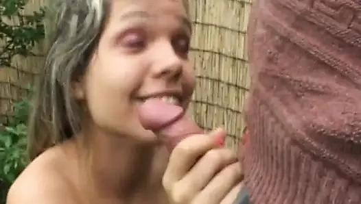 Dirty old man get his cock sucked by a young brunette in the garden