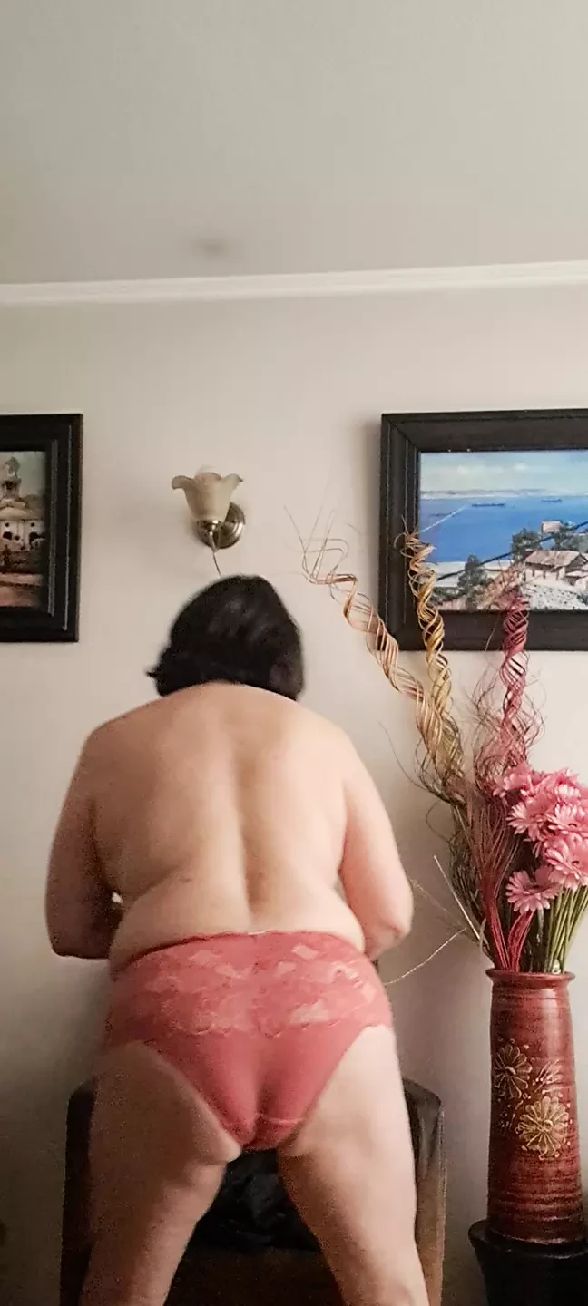 in underwear tidying up and the neighbor watching