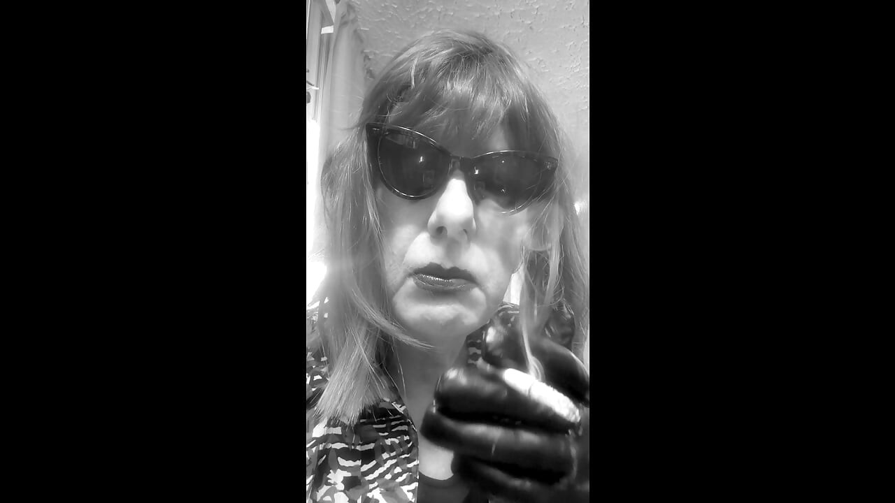 MRS. ROMAN DESTROYING A MARLBORO 100 MENTHOL CLOSE UP - WITH DANGLING AND NOSTRIL EXHALES