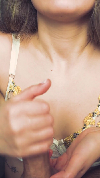 Jaw-dropping moment from "Beauty in beautiful lingerie jerks off her boyfriend. Passionate handjob from a young milf."