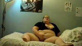 Fat girl  masturbating on bed