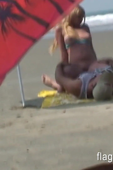 Brazilian couple having sex on the empty beach