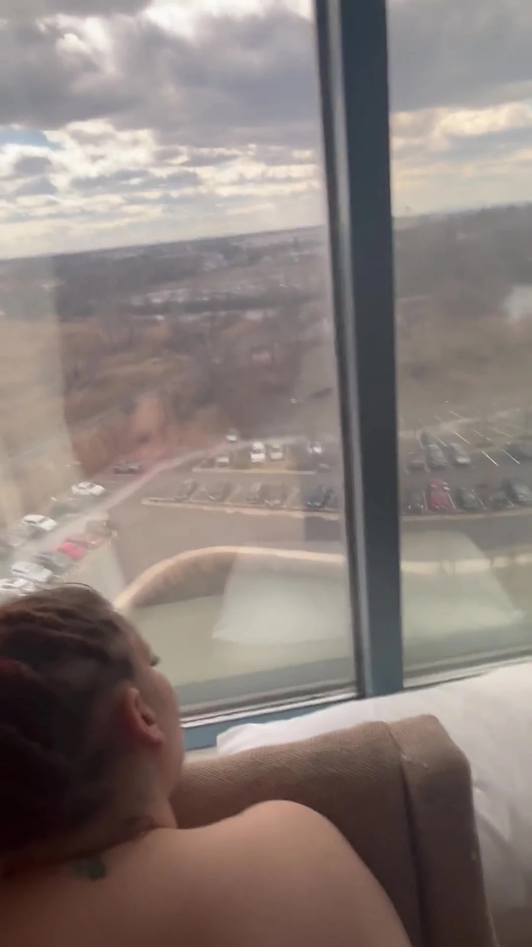 Giving Backshots While Looking Out of 12th Story Hotel