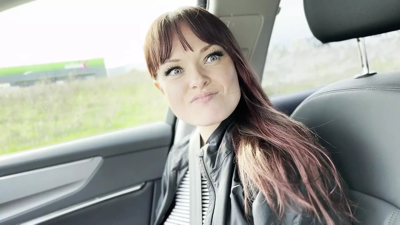 A Hitchhiker Plays with the Driver in the Front Seat