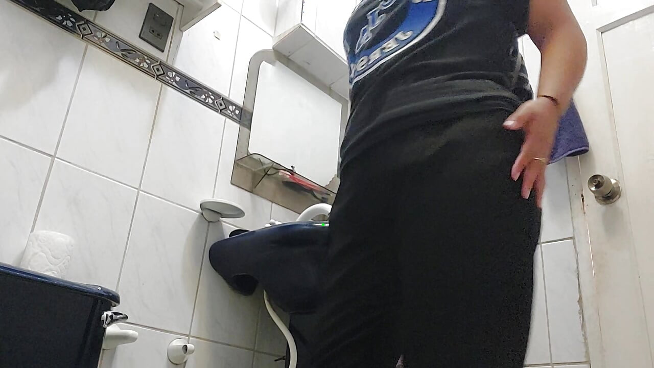 Colombian big ass takes a shower in a black thong and then changes.