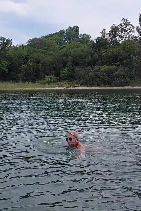 Sexy Granny Swims Naked in a Lake!