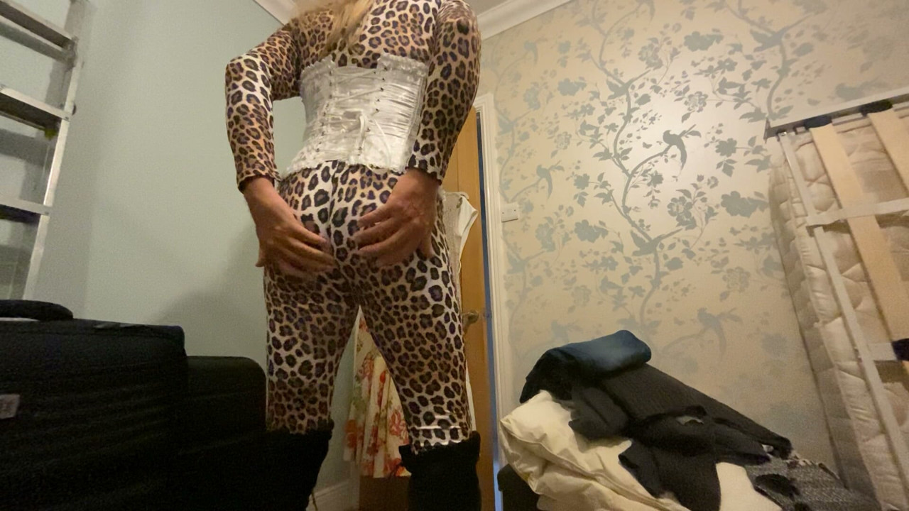 Mature CD Joanne posing in tight animal print bodysuit