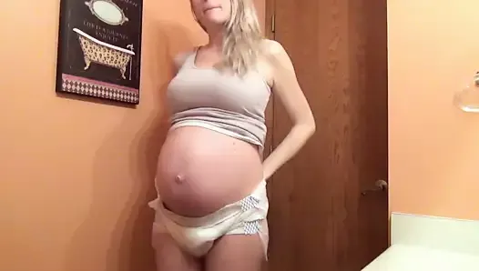 heavy pregnant babe wetting diaper
