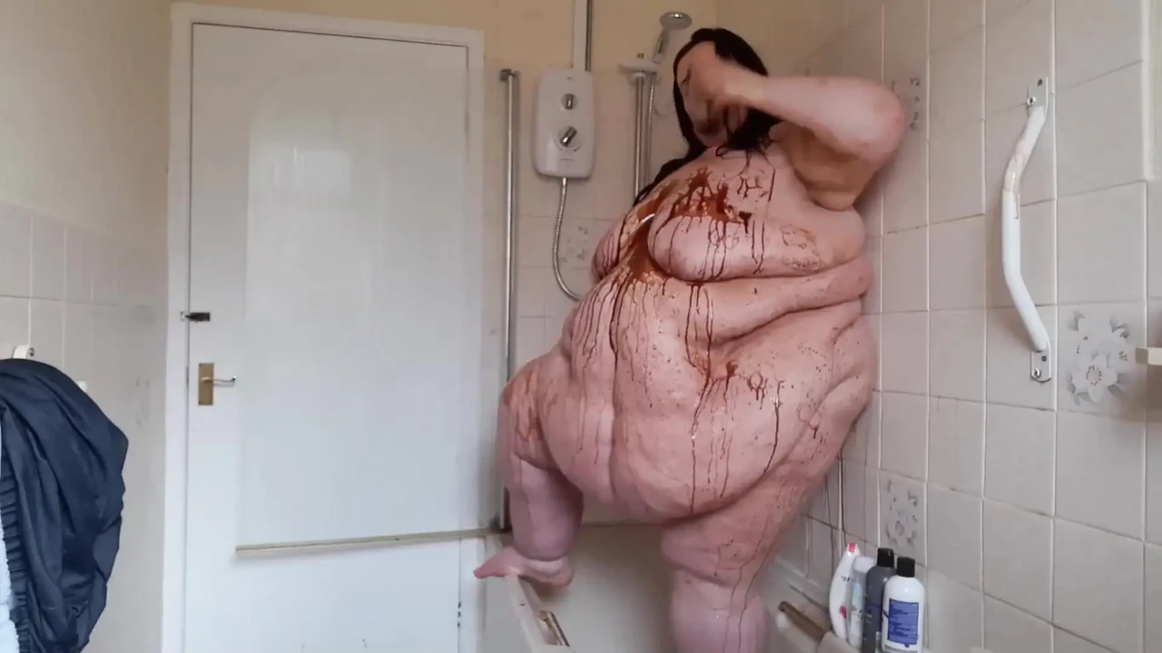 Ssbbw body covered in chocolate sauce in shower