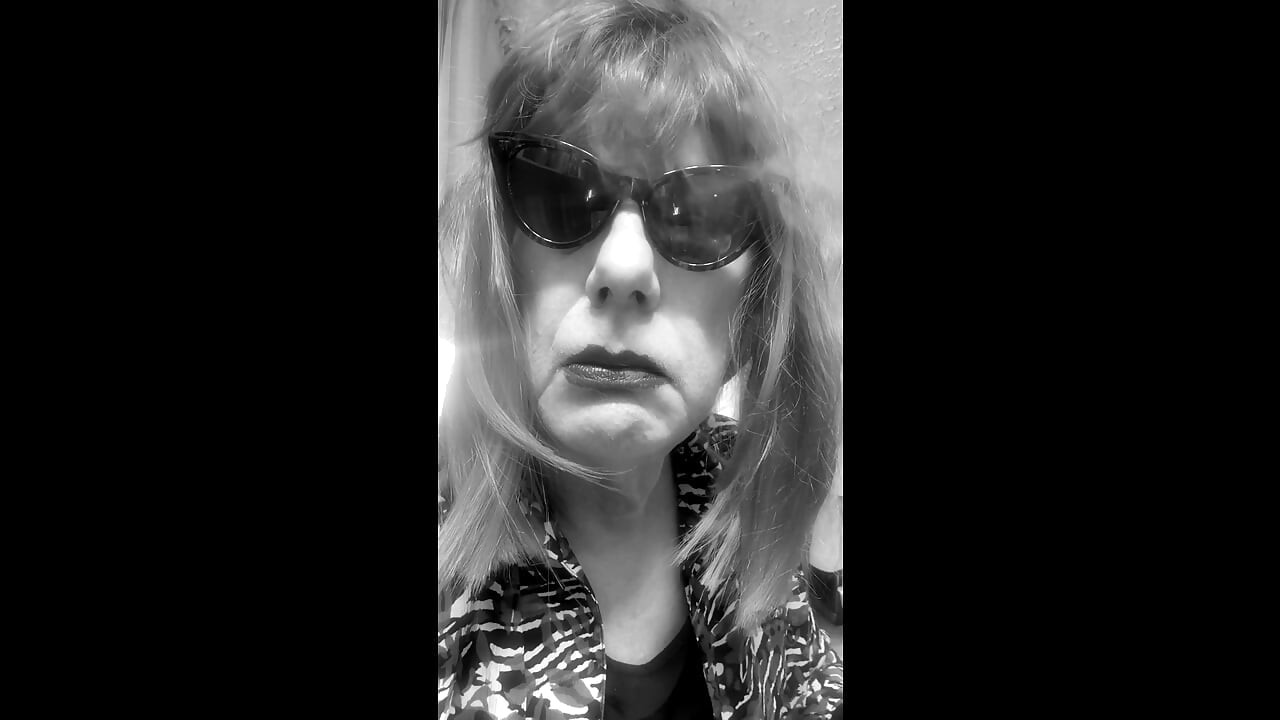 MRS. ROMAN DESTROYING A MARLBORO 100 MENTHOL CLOSE UP - WITH DANGLING AND NOSTRIL EXHALES