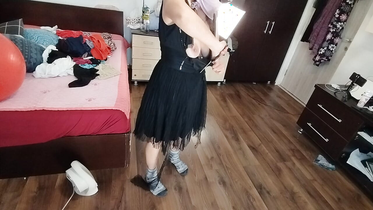 Amateur Woman Has Fun Trying on Clothes and Cutting Them.