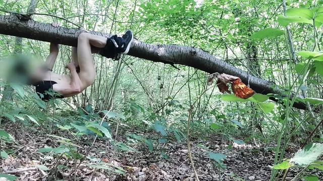 Handjob hanging from a forest tree