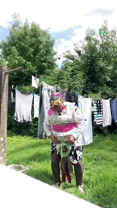 In gardening outfit to hang the laundry