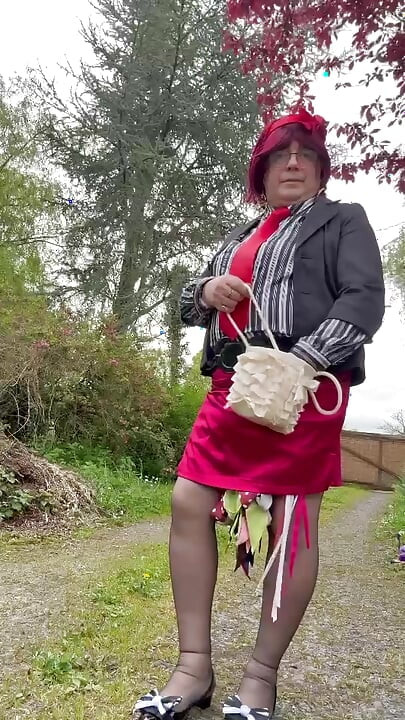 Dressed in an outfit with a short red skirt for the evening