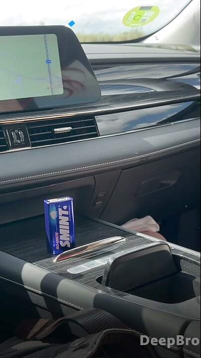 Redhead deepthroats thick BBC in the car, fingers gripping tight
