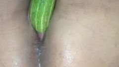 Horny girl using cucumber to masturbate, but it doesn't fit