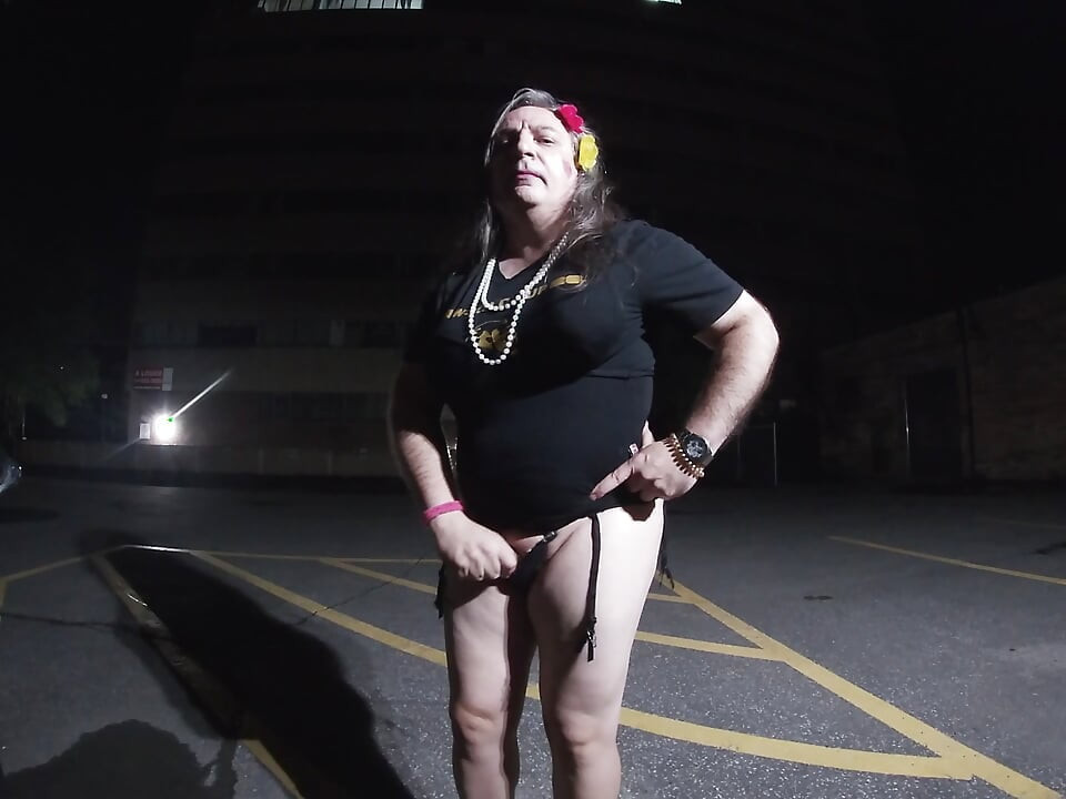 Solo feminized Mature CD goes for a walk in a parking lot