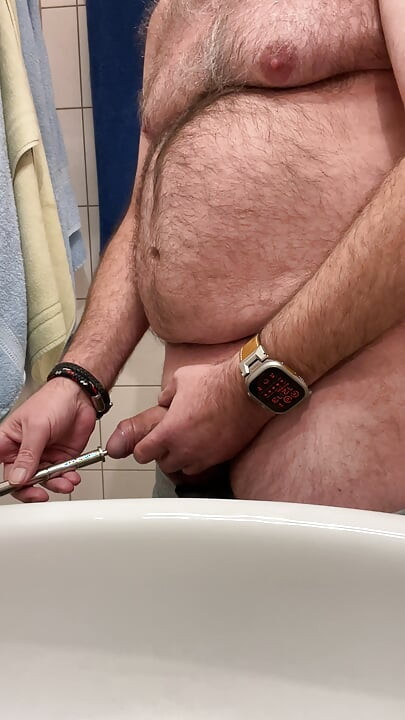 Dilator dengan getaran dan pancutan mani