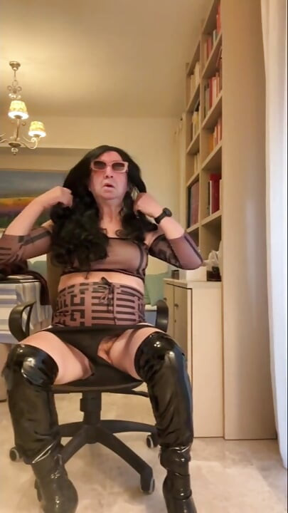 Hot Spanish trans girl cums in a sexy dress, high-heeled boots, and anal sex