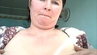 Natasha jerks off her tits